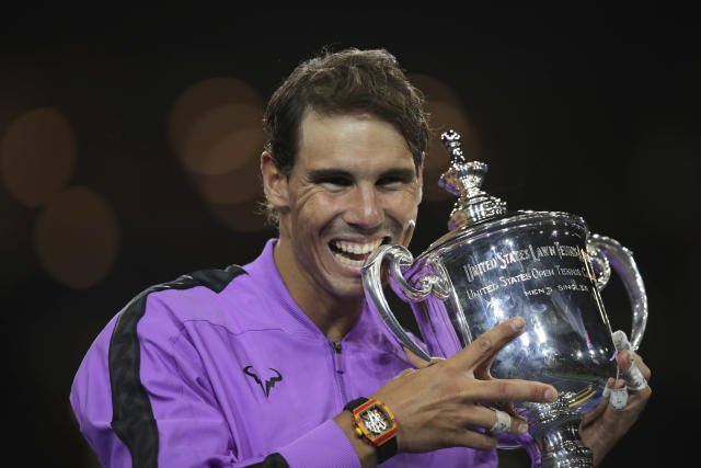 Rafael Nadal, of Spain, poses with the championship trophy after defeating Daniil Medvedev, of Russia, to win the men's singles final of the U.S. Open tennis championships Sunday, Sept. 8, 2019, in New York. (AP Photo/Charles Krupa)