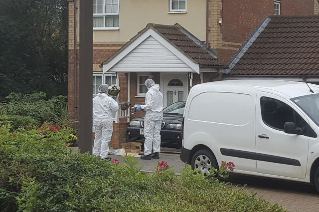 Police attend the scene where two teenage boys were stabbed to death Saturday night following an altercation, in Milton Keynes, southern England, Sunday Oct. 20, 2019. One of the the 17-year-old victims, who have not been named by police, died at the scene, while the other died later in hospital Sunday morning. (Gus Carter/PA via AP)