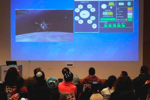 People watch a screen showing explanations of the landing of Israeli spacecraft, Beresheet's, at the Planetaya Planetarium in the Israeli city of Netanya, on April 11, 2019 before it crashed during the landing. (Photo by JACK GUEZ / AFP)JACK GUEZ/AFP/Getty Images