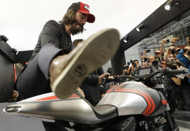 Actor Keanu Reeves mounts on a Arch 1S during the unveiling of his Arch motorcycles at the EICMA exhibition motorcycling fair in Milan, Italy, Wednesday, Nov. 8, 2017. (AP Photo/Luca Bruno)