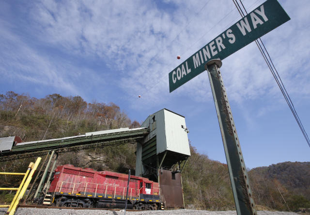 A road sign is posted at the entranced the closed Spruce Creek coal mine in Matewan, W.Va., Friday, Nov. 11, 2016. The hard-eyed view along the Tug Fork River in coal country is that Donald Trump has to prove he'll help Appalachian mining like he promised. (AP Photo/Steve Helber)