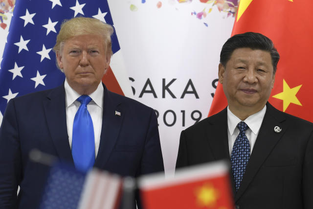 President Donald Trump, left, poses for a photo with Chinese President Xi Jinping during a meeting on the sidelines of the G-20 summit in Osaka, Japan, Saturday, June 29, 2019. (AP Photo/Susan Walsh)