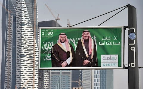 portraits of Saudi King Salman (R) and his son Crown Prince Mohammed bin Salman (MBS) are displayed in Riyadh - Credit: FAYEZ NURELDINE/AFP/Getty Images