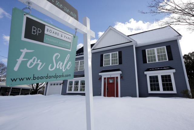 In this Thursday, Feb. 21, 2019 photo a newly constructed home sits near a sign, in Natick, Mass. On Thursday, Feb. 28, Freddie Mac reports on this week’s average U.S. mortgage rates. (AP Photo/Steven Senne)
