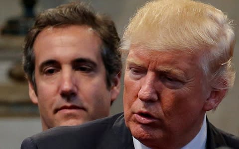 Cohen, who once said he would 'take a bullet' for the president, made a series of claims on Friday  - Credit: Reuters