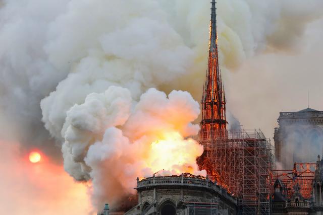 Smoke and flames rise during a fire at the landmark Notre-Dame Cathedral in central Paris on April 15, 2019, potentially involving renovation works being carried out at the site, the fire service said. - A major fire broke out at the landmark Notre-Dame Cathedral in central Paris sending flames and huge clouds of grey smoke billowing into the sky, the fire service said. The flames and smoke plumed from the spire and roof of the gothic cathedral, visited by millions of people a year, where renovations are currently underway. (Photo by FRANCOIS GUILLOT / AFP) (Photo credit should read FRANCOIS GUILLOT/AFP/Getty Images)