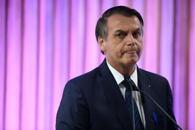 Brazilian President Jair Bolsonaro gestures during a ceremony at the Federation of Industries of Rio de Janeiro (FIRJAN) headquarters in Rio de Janeiro on May 20, 2019. (Photo by MAURO PIMENTEL / AFP) (Photo credit should read MAURO PIMENTEL/AFP/Getty Images)