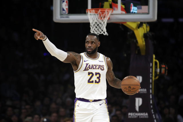 Los Angeles Lakers' LeBron James (23) dribbles down court against the Dallas Mavericks during the first half of an NBA basketball game Sunday, Dec. 1, 2019, in Los Angeles. (AP Photo/Marcio Jose Sanchez)
