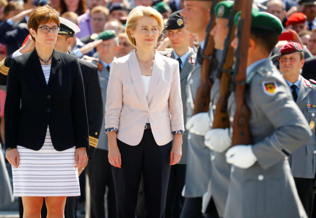 Incoming German defense minister Annegret Kramp-Karrenbauer and outgoing minister and elected European Commission President Ursula von der Leyen attend a welcoming ceremony for a new minister at the Defense Ministry in Berlin, Germany, July 17, 2019. REUTERS/Hannibal Hanschke