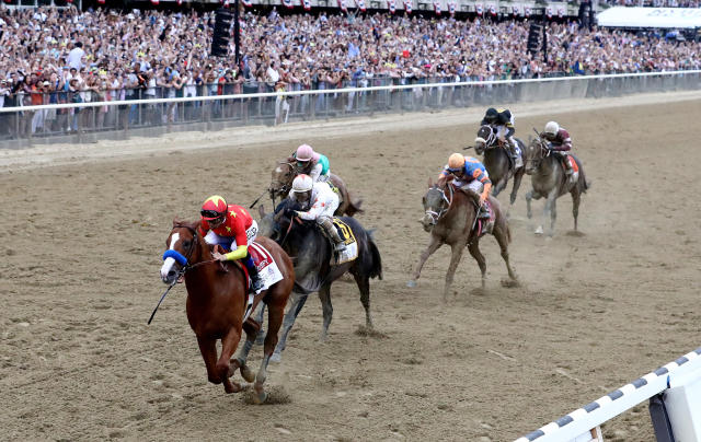 Justify won the 150th running on the Belmont Stakes to complete the 13th Triple Crown in horse racing history. (Getty)