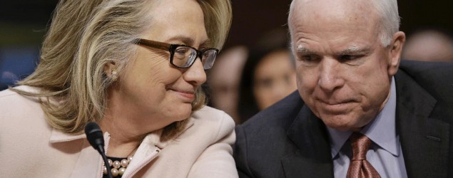 Then-Secretary of State Hillary Rodham Clinton huddles with Sen. John McCain, R-Ariz., on Capitol Hill in January 2013 (J. Scott Applewhite/File/AP)
