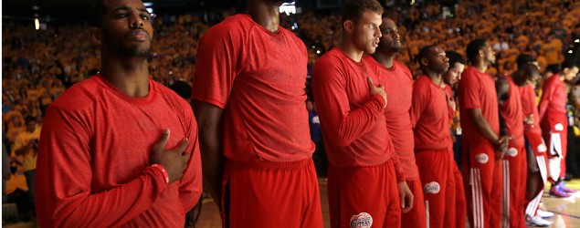 Clippers players stage silent protest against owner Donald Sterling after his alleged racist remarks. (Getty Images)