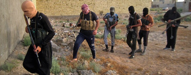 Masked antigovernment gunmen patrolling Fallujah, Iraq, after al-Qaida-linked fighters and their allies seized the city. (AP)